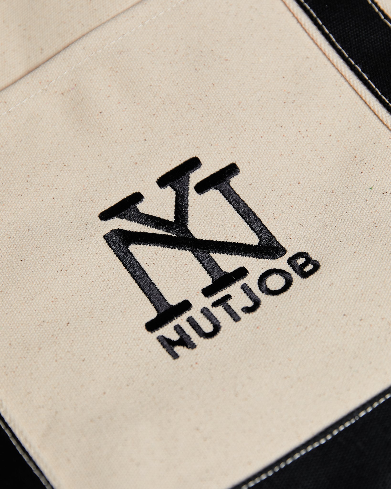 Black & cream Heavy Duty Canvas tote with embroidered NEW YORK NUTJOB logo