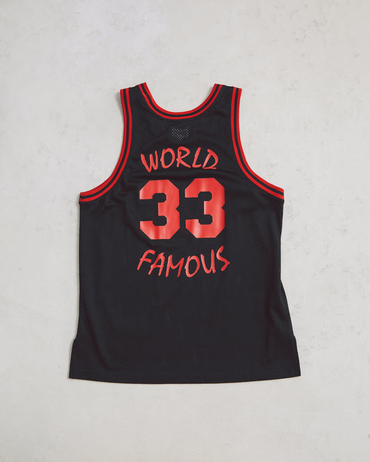 Black Supreme Basketball jersey blank on the front and #33 and world famous on the back